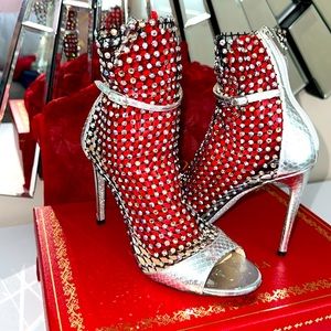 Stilettos boots with crystal AB Swarovski embellishments.